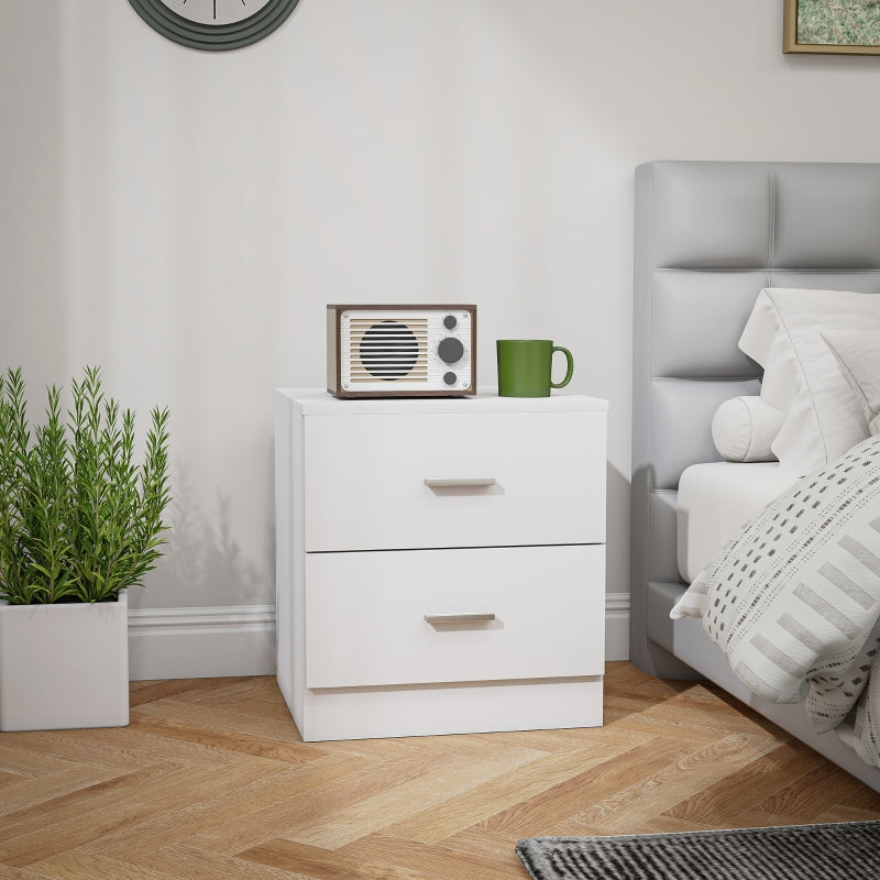 White two-drawer bedside table beside a bed