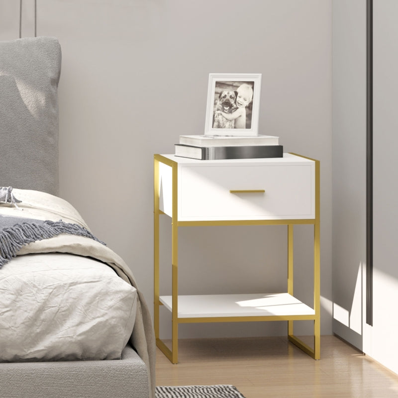 White and gold bedside table next to a bed