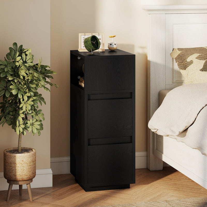 Slim black bedside table beside a bed