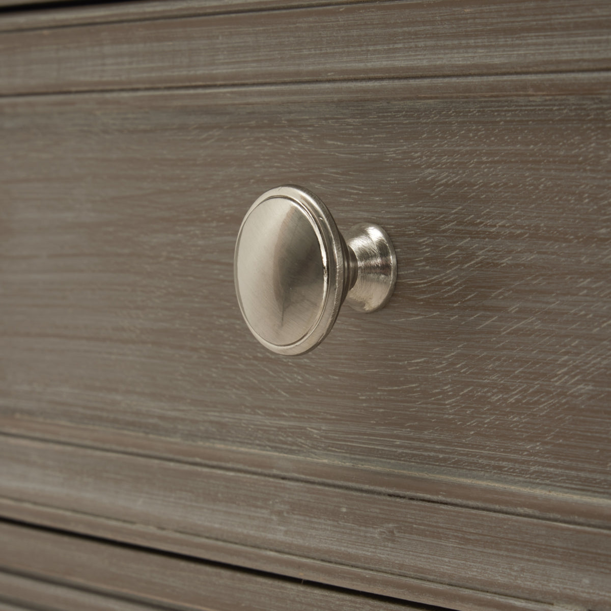 Close-up of the silver knob on the Serene side table drawer