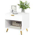 White bedside table with fluted drawer, open shelf and gold-tone legs