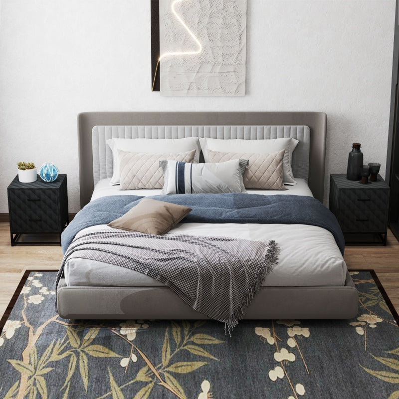 Black diamond-pattern bedside tables on each side of a bed