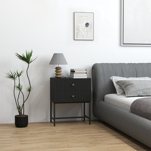 Black bedside table with metal frame beside a bed