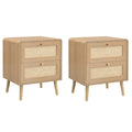 Set of two natural oak bedside tables with rattan-effect two-drawer fronts on a white background