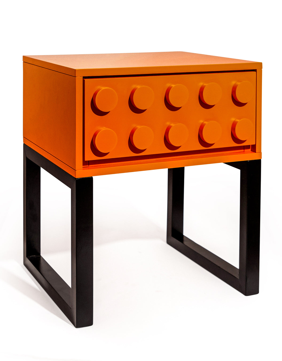 Colour block bedside table in orange, 46.5 cm wide, one studded drawer on a black open frame