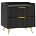 Black two-drawer bedside table with fluted fronts and gold-tone legs