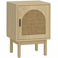 Natural wood bedside table with arched rattan door panel on round legs on a white background