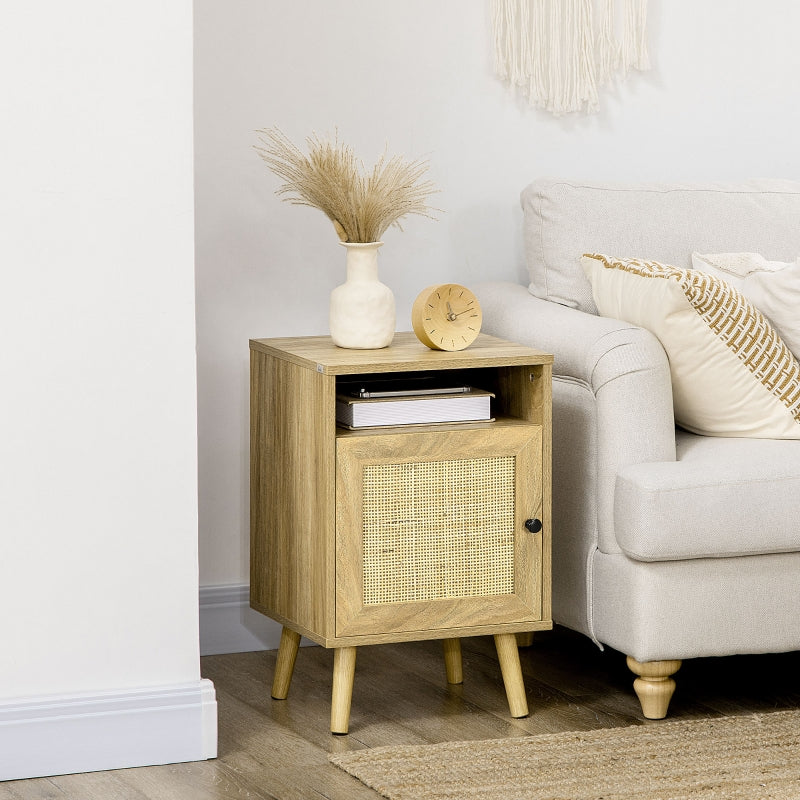 Rattan-door bedside table beside a sofa with a vase and clock