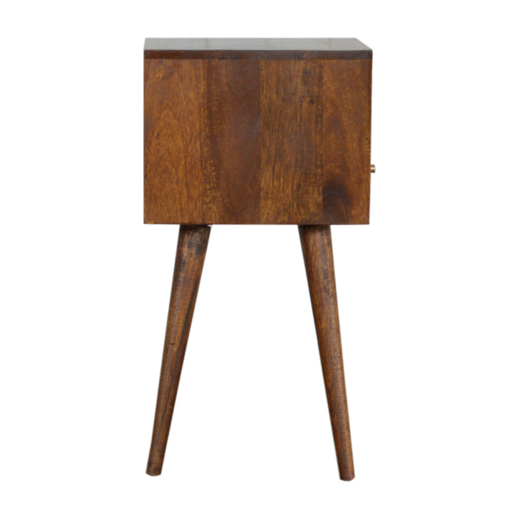 Side view of the chestnut bedside table with the drawer knob visible at the edge and tapered legs