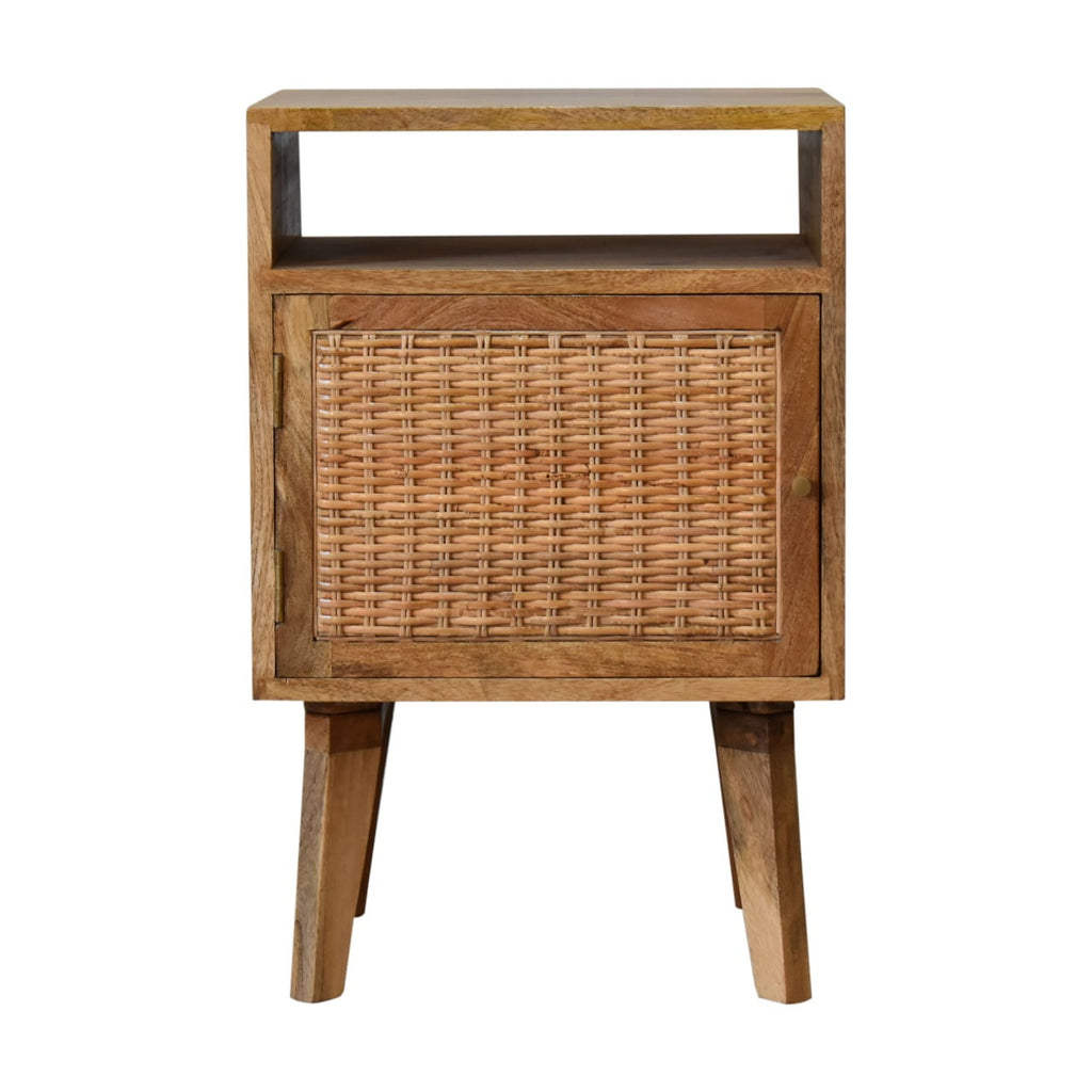 Light oak-tone bedside cabinet with a woven rattan door and an open cubby above, on four tapered legs, front view