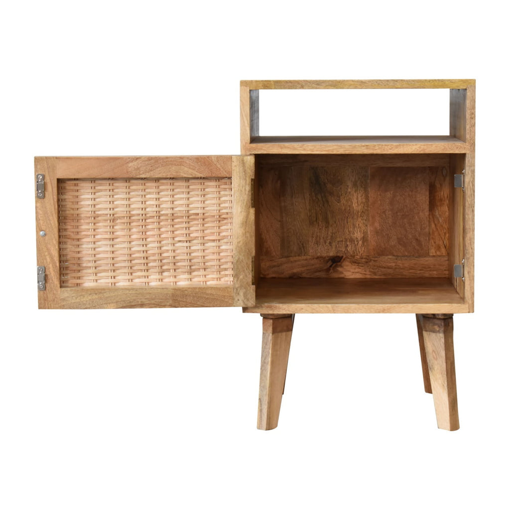 Bedside cabinet with the rattan door swung open to the left, showing the empty compartment behind it