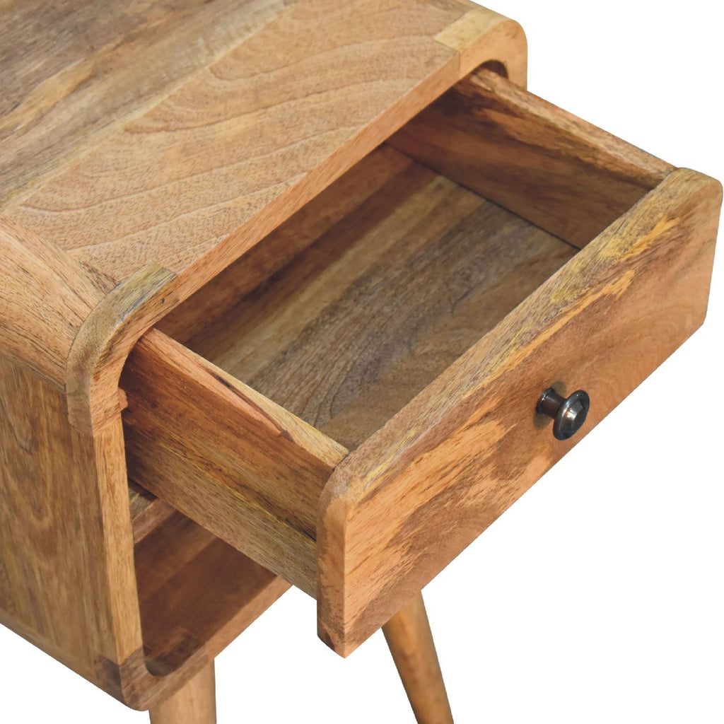 Mini oak-ish bedside with the drawer open