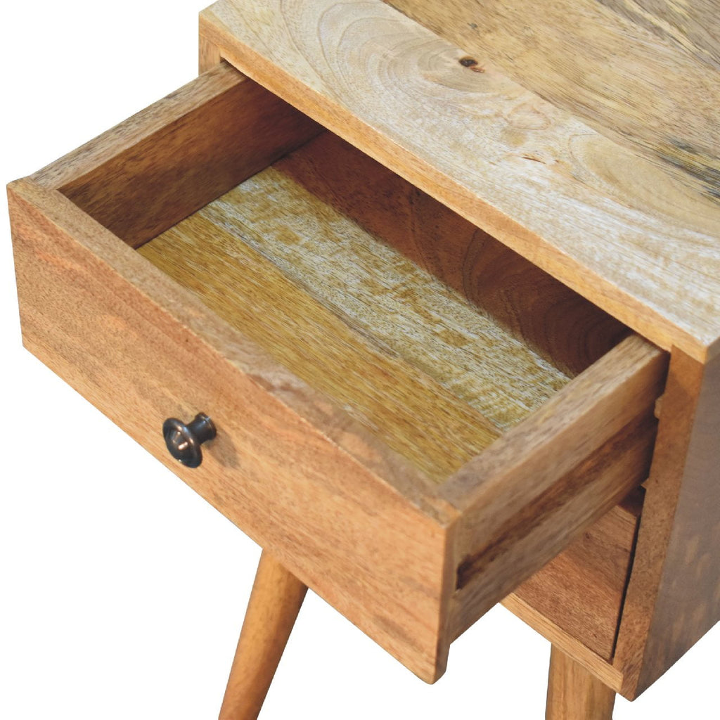 Mini oak-ish bedside with the top drawer open