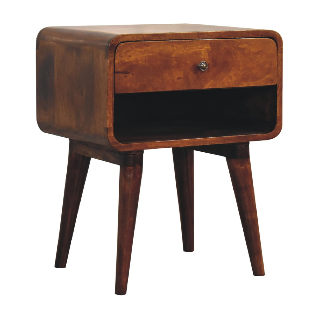 Chestnut bedside table with rounded corners, drawer and open niche below, three-quarter view showing the side panel and splayed legs
