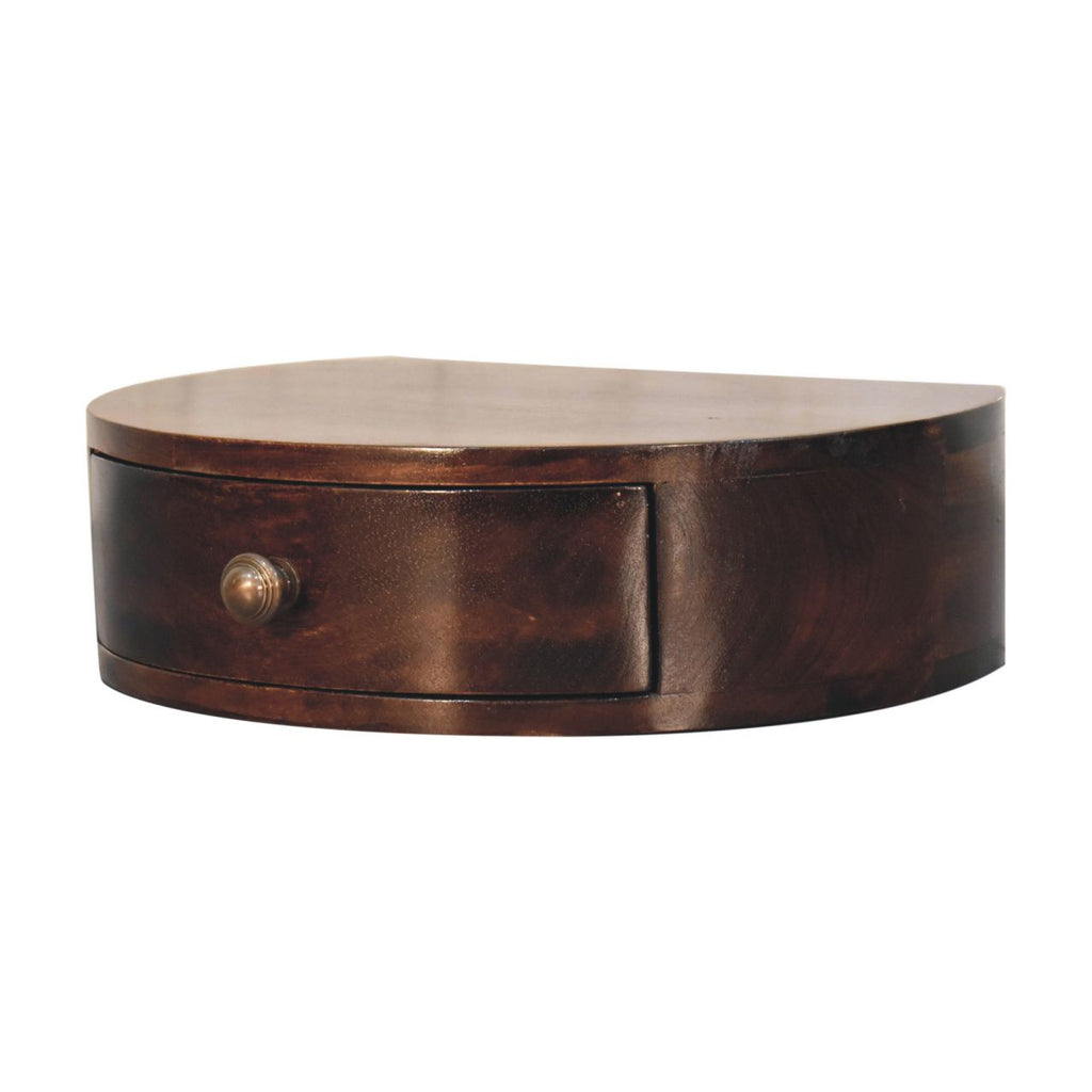 Wall mounted rounded bedside, three-quarter view from the right with drawer knob