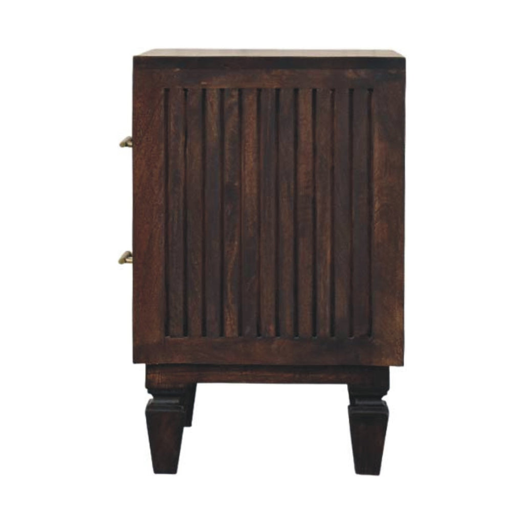 Side view of the fluted nightstand showing fluted side panel and tapered legs