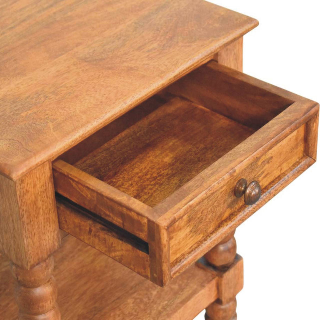 Spindle bedside with the drawer open