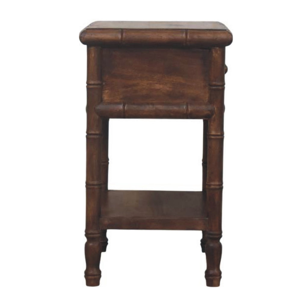 Side view of the dark brown bedside table with ring-turned legs and the lower shelf