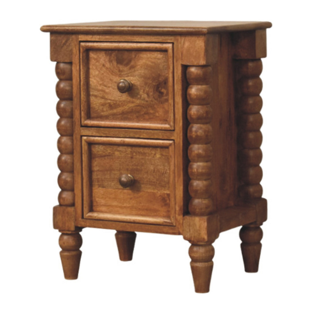 Amber-brown bedside table with two drawers, three-quarter view showing the bobbin columns and turned feet