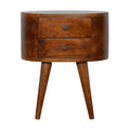 Oval chestnut bedside table with two stacked drawers and round knobs on four tapered legs, front view