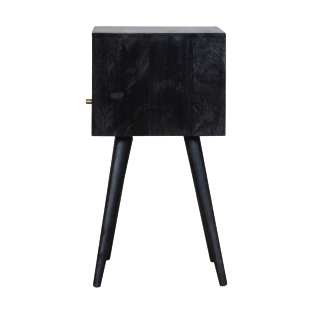 Side view of the small black bedside table with the drawer knob at the left edge and tapered legs