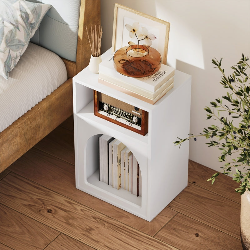 White bedside table styled with books and a radio