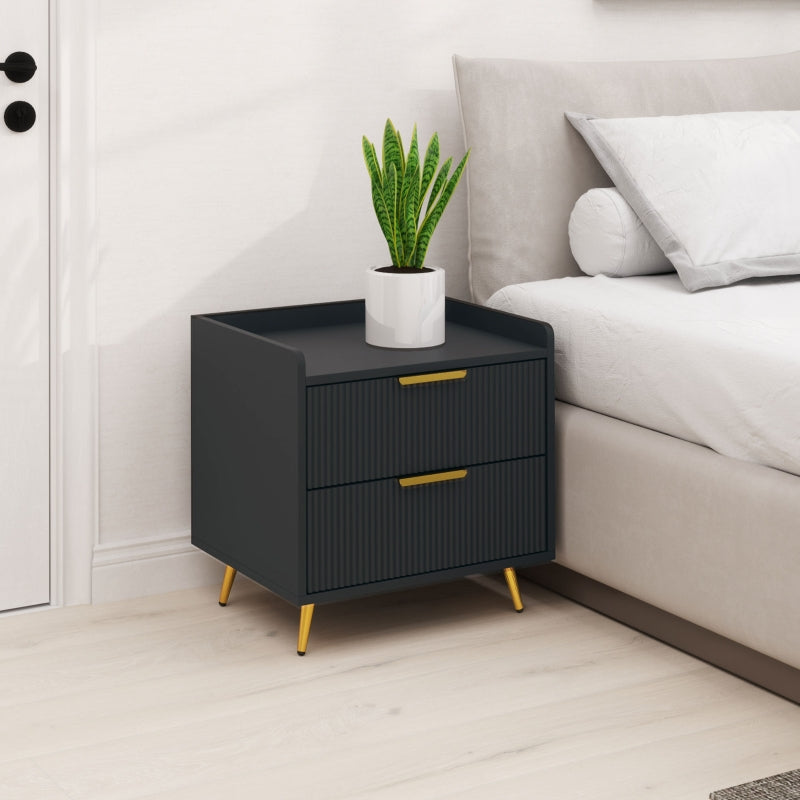 Black fluted bedside table beside a bed