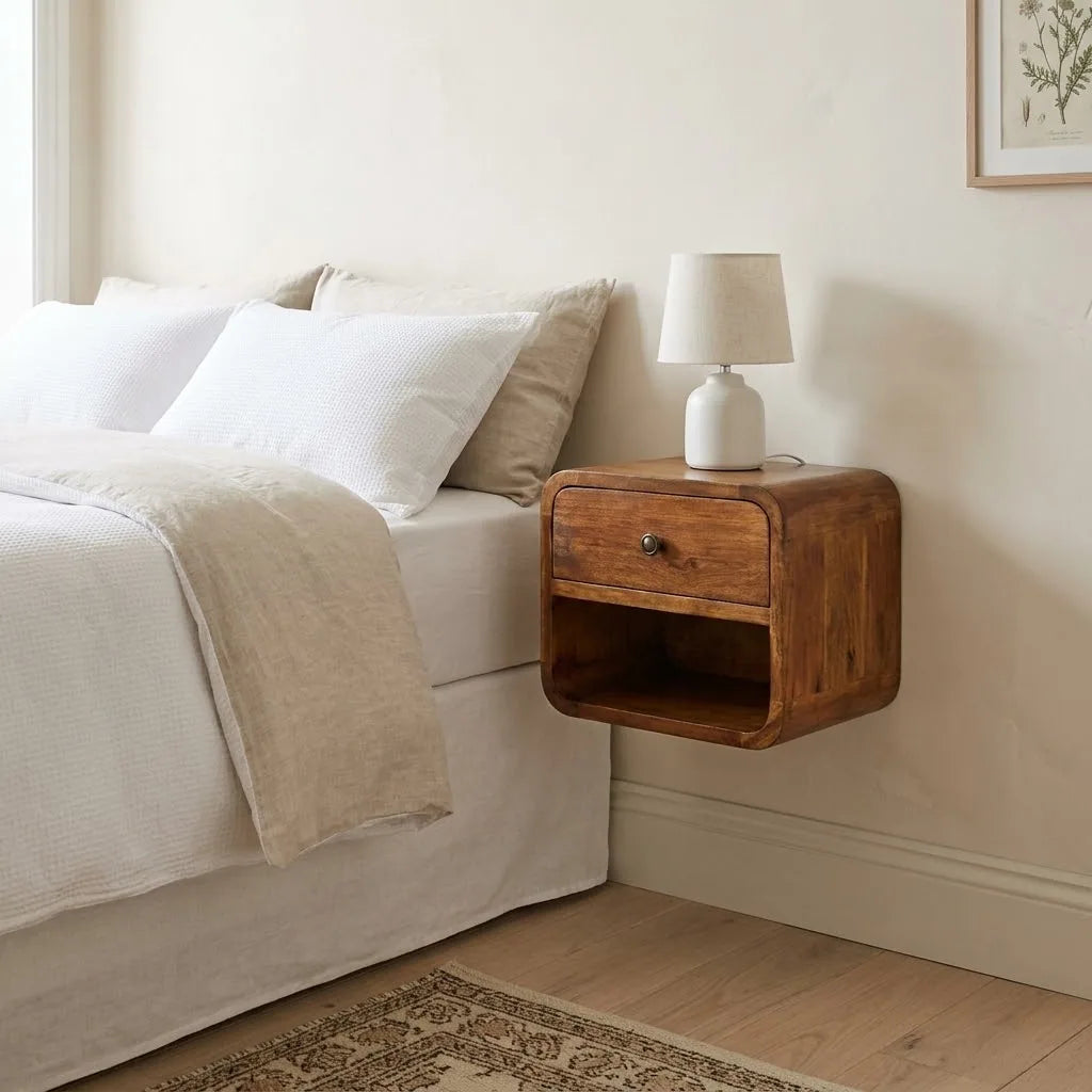 Coln 30 cm Wall Mounted Bedside Table fixed to the wall beside a bed, with a table lamp on top