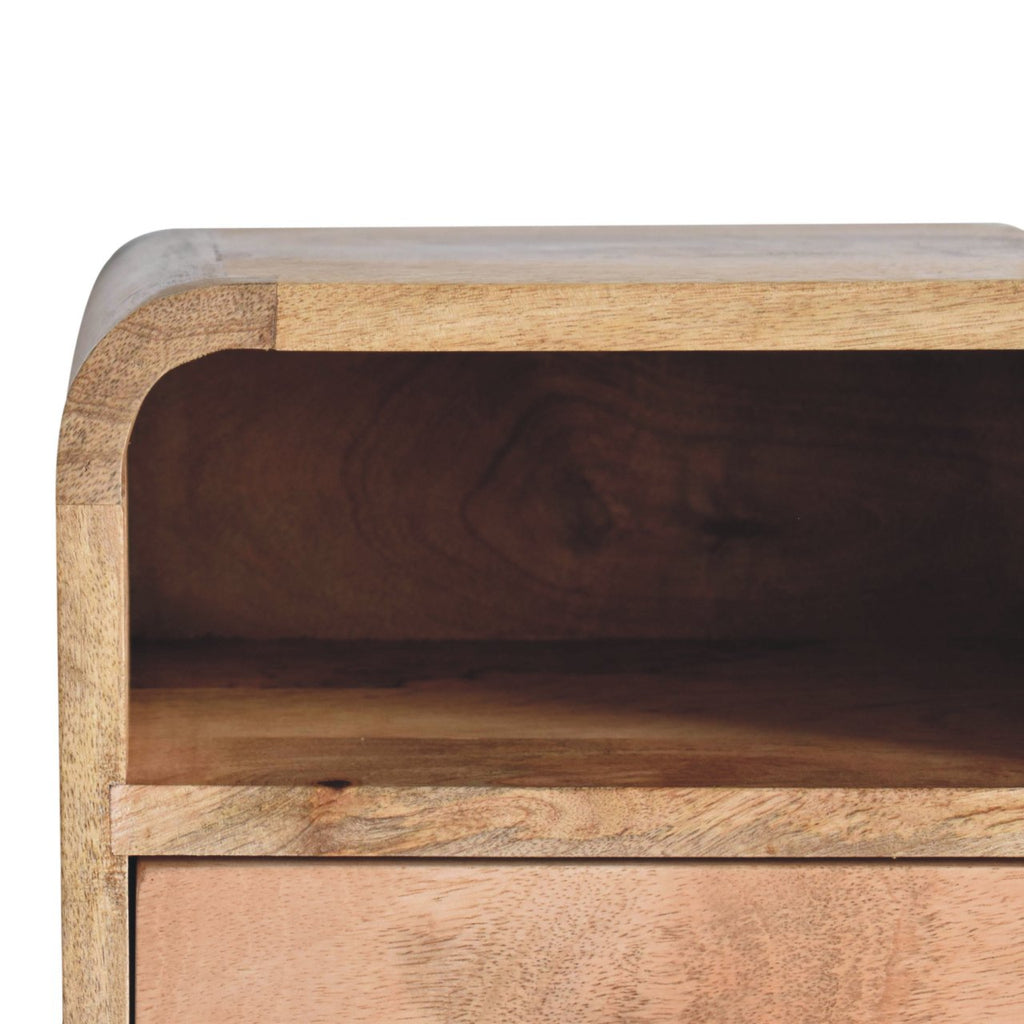 Curved wall-mounted bedside table, 30 cm wide, close-up of the light top corner and open slot