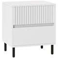 White two-drawer bedside table with fluted front and black legs
