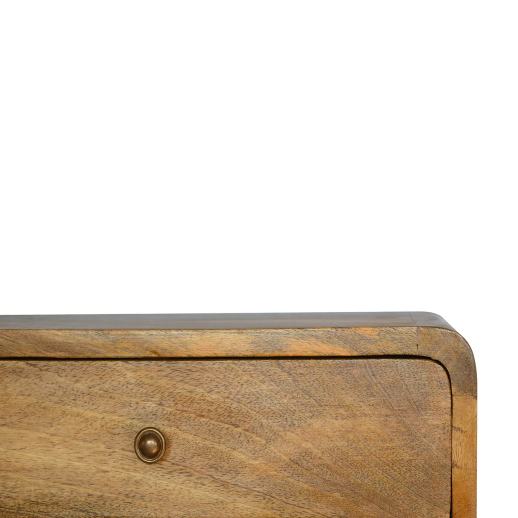 Floating bedside table, 45 cm wide, close-up of the light top corner and drawer knob