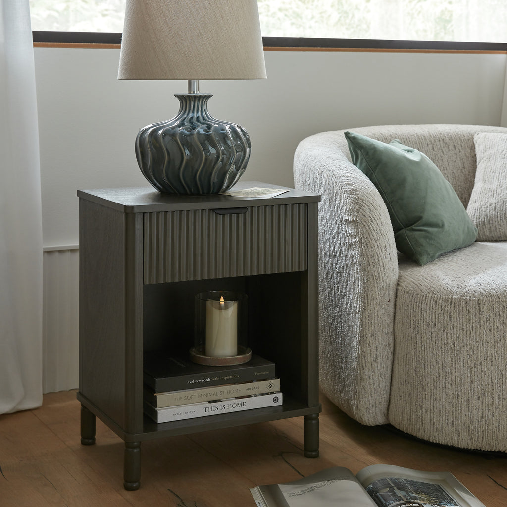 45 cm bedside table with a drawer and open shelf next to an armchair