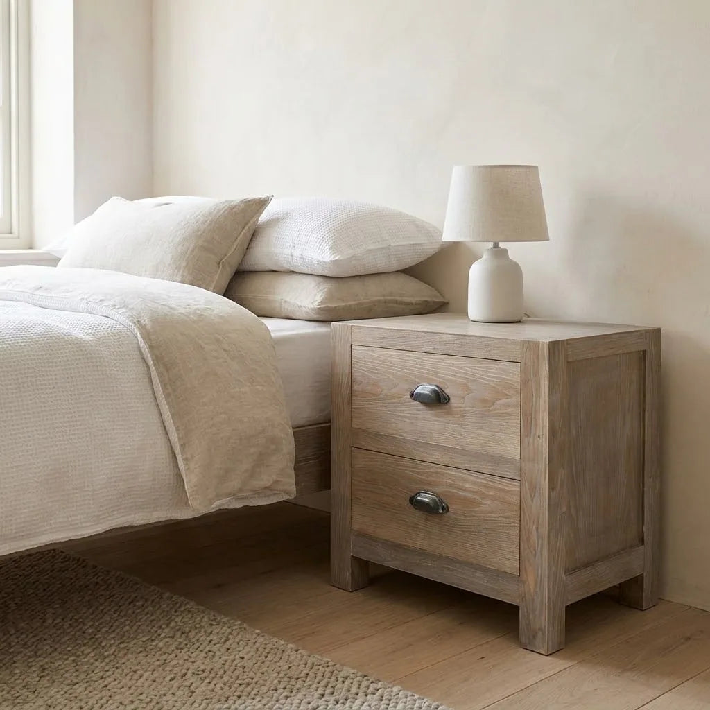 Itchen 55 cm Bedside Table beside a bed with linen bedding, with a table lamp on top