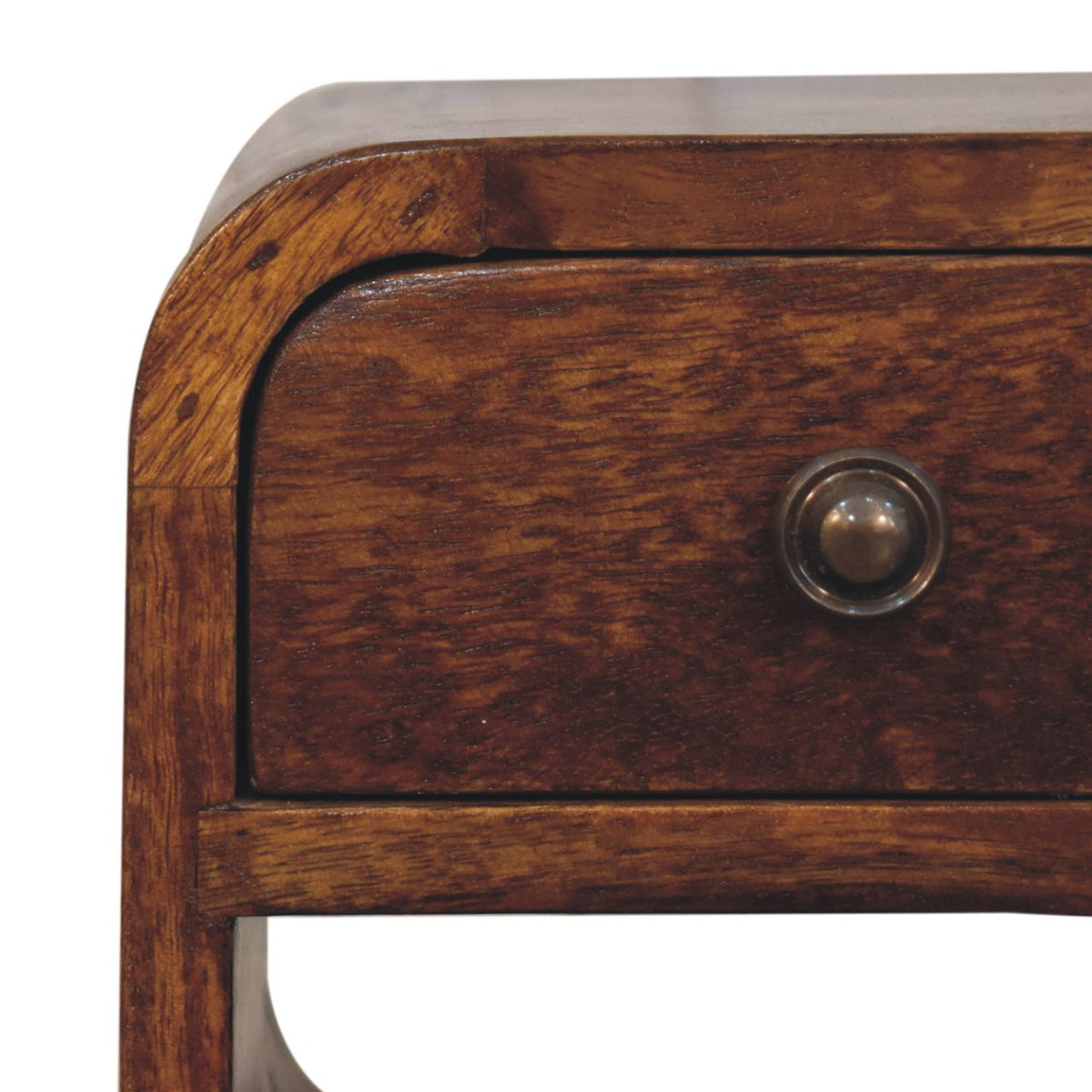 Narrow bedside table in chestnut brown, close-up of the wood grain and round drawer knob