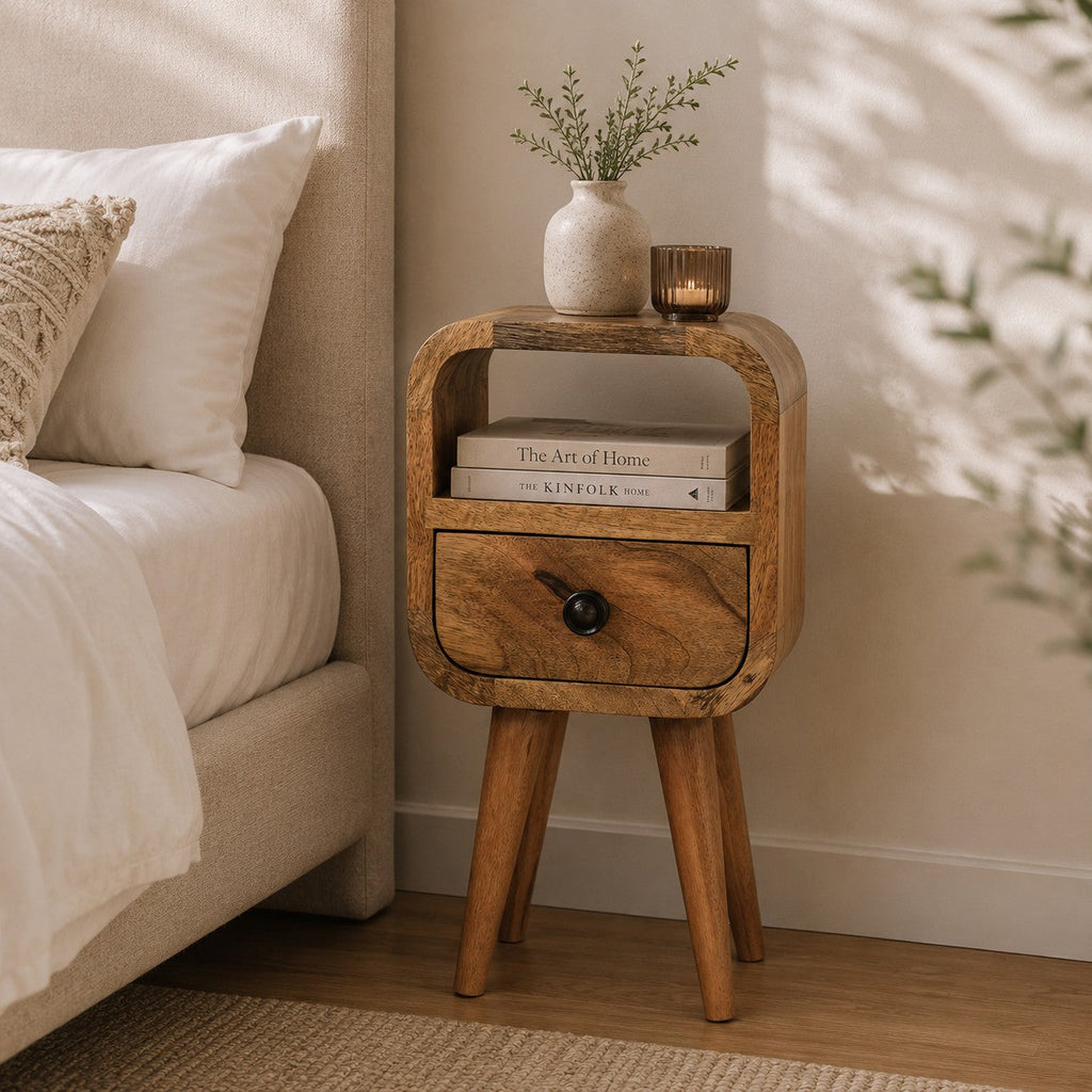 Narrow bedside table with drawer, 20 cm wide, light oak-look wood, in a bedroom beside a bed