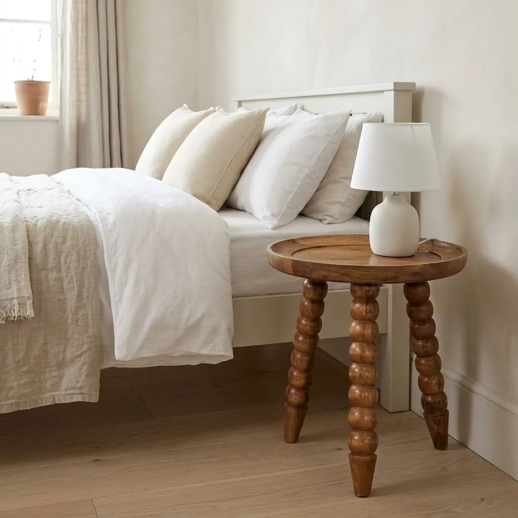 Swale 40 cm Tray Top Bedside Table beside a bed with linen bedding, with a table lamp on top