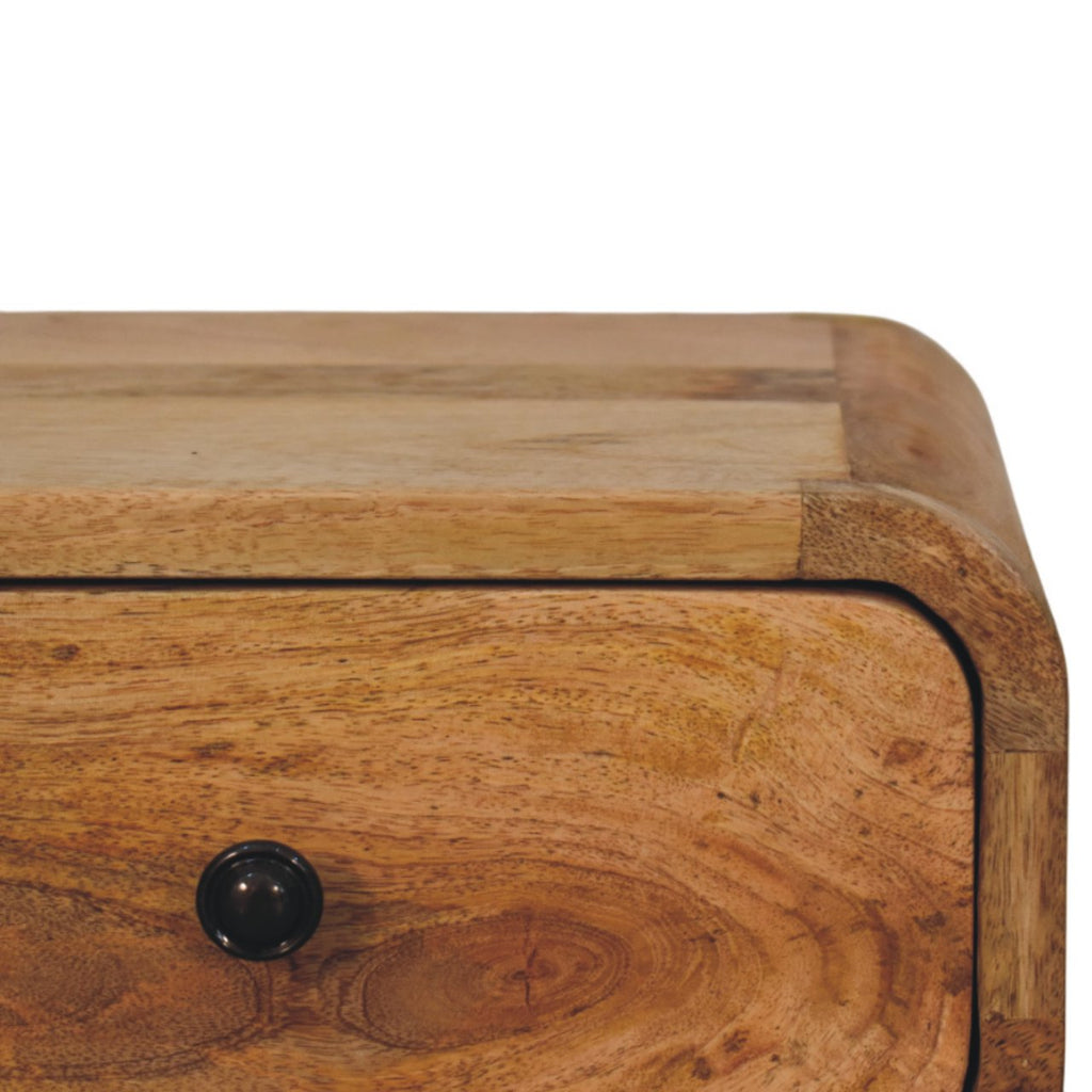 Close-up of the rounded corner and knob on the light drawer