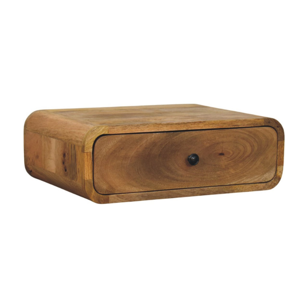Wall-mounted bedside table with drawer, 45 cm wide, light honey wood, angled view
